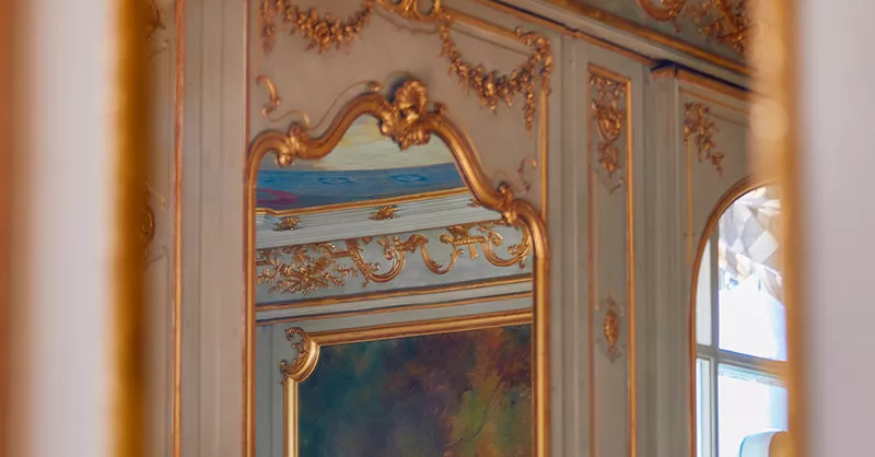 An exceptional living room in a luxury apartment with a view of a city