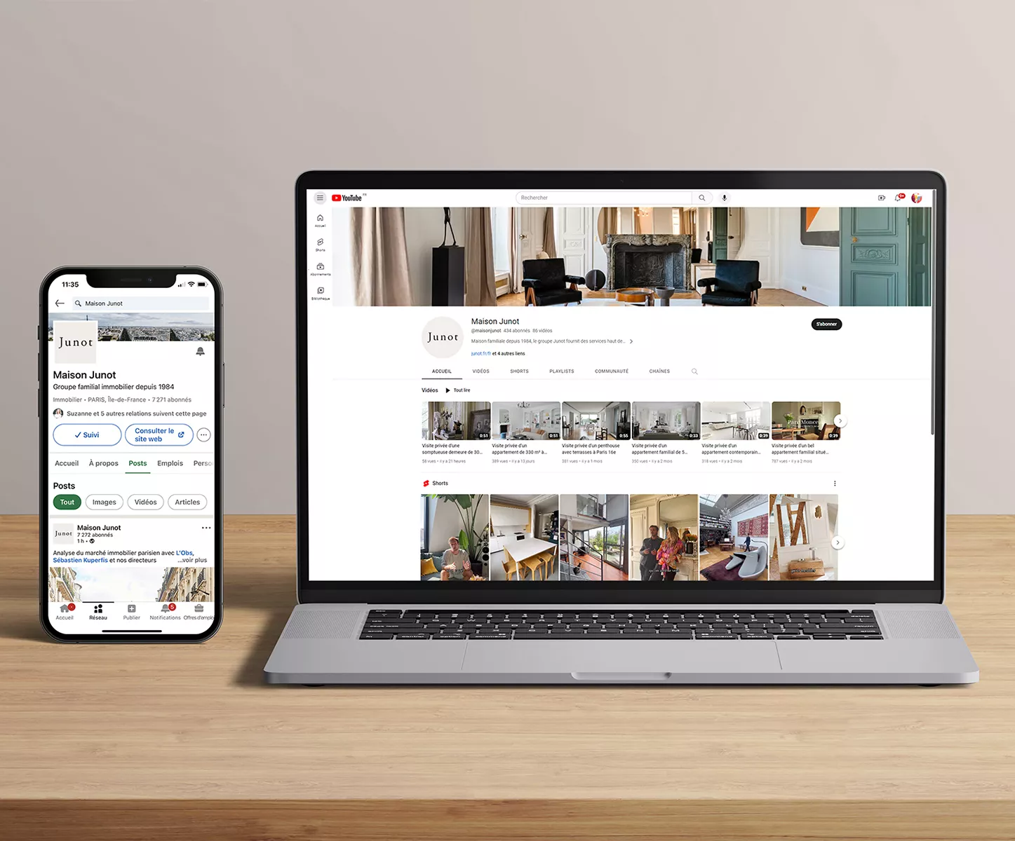 A computer and a telephone open on the Junot Real Estate website