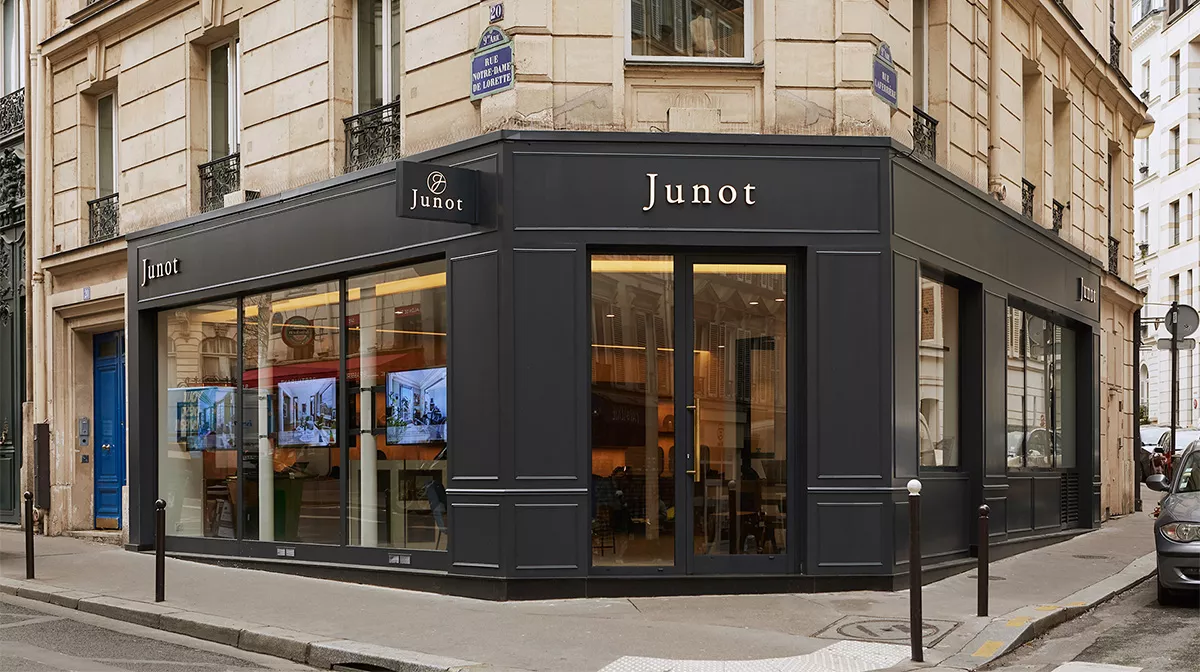 Window display of the Junot Saint Georges agency in the 9th arrondissement of Paris