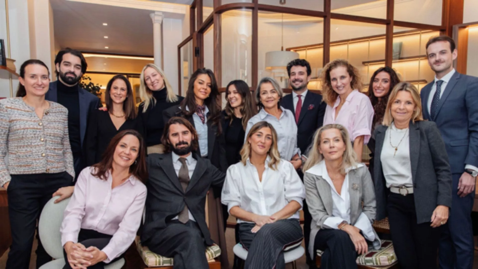 Team of Junot consultants smiling at the camera