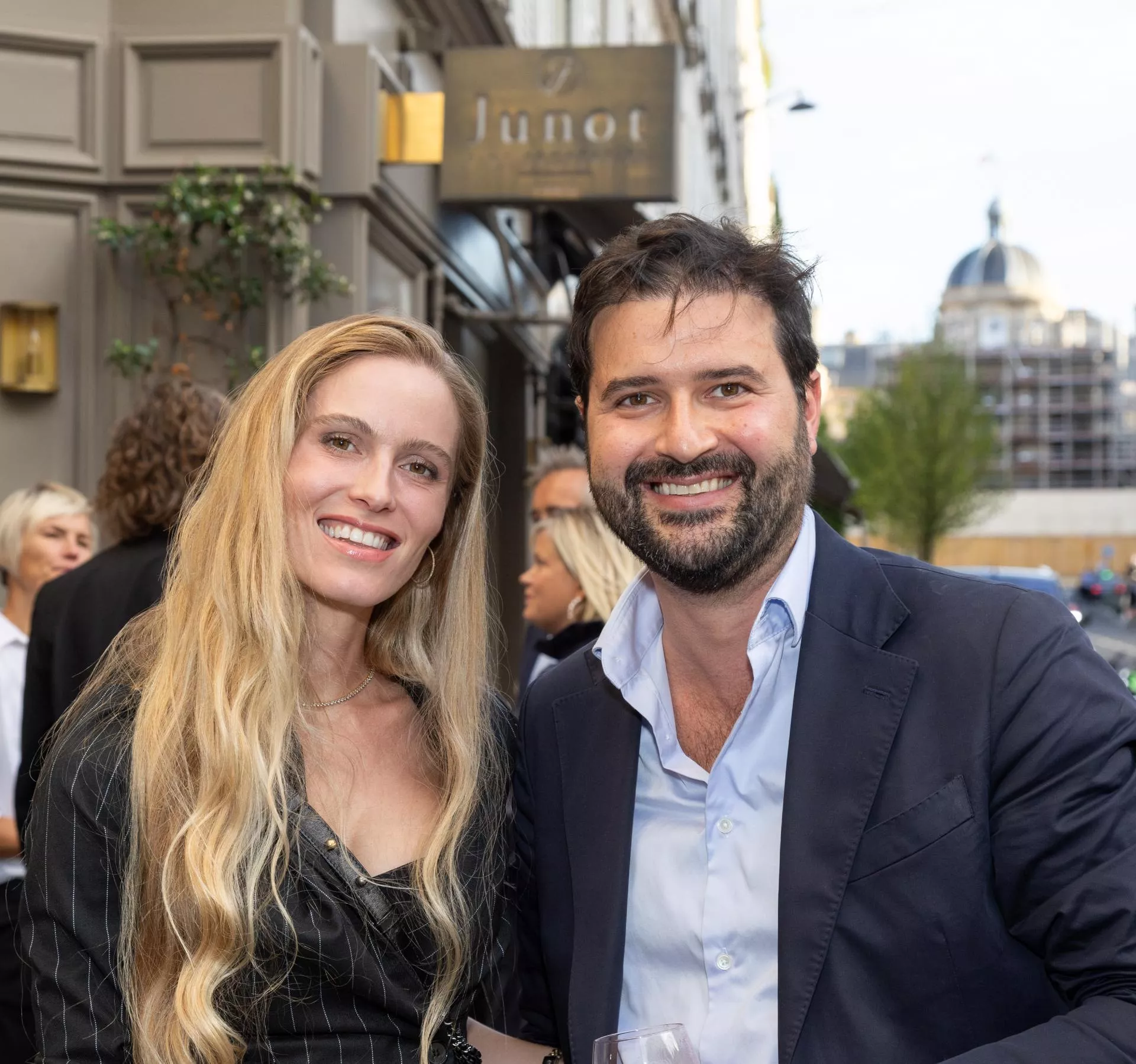 Two Junot real estate agents smiling