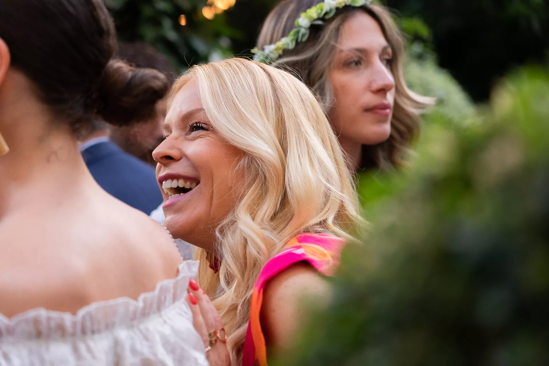 Blonde Junot consultant laughing at a Junot party