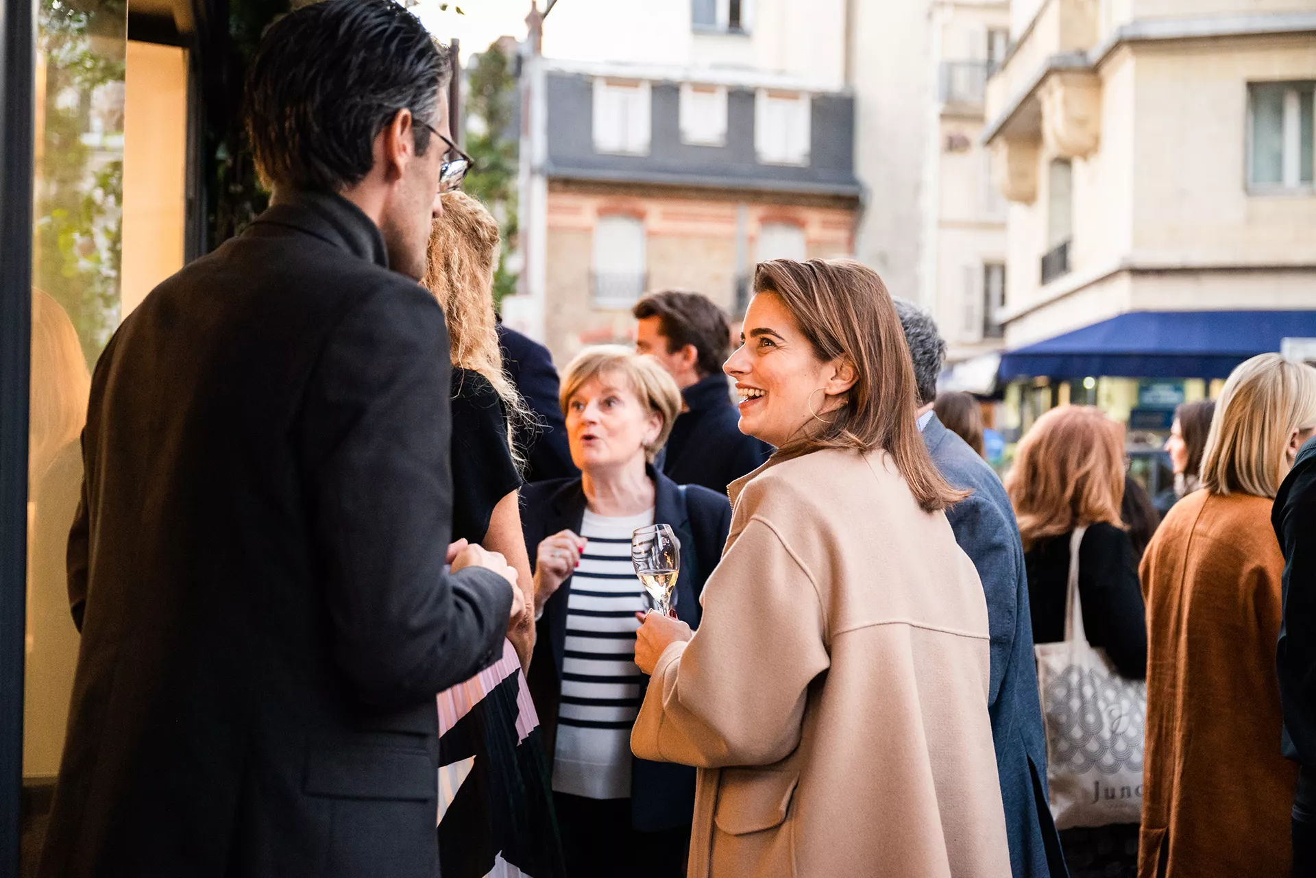 Junot consultants at a Junot party laughing together