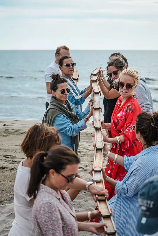 The Junot team on the beach during a seminar organized by Junot