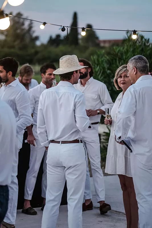 The Junot team dressed in white during a Junot seminar