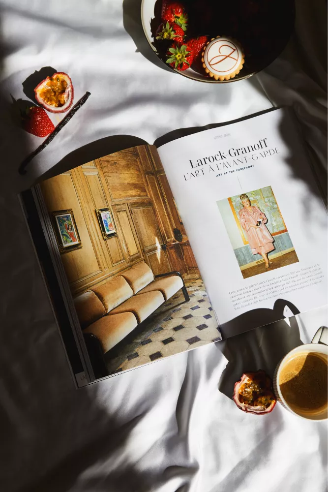 The Junot Magazine closed on a wooden table