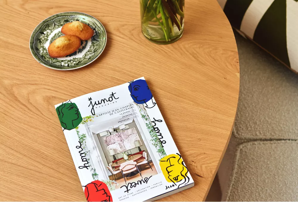 Person leafing through Junot Magazine